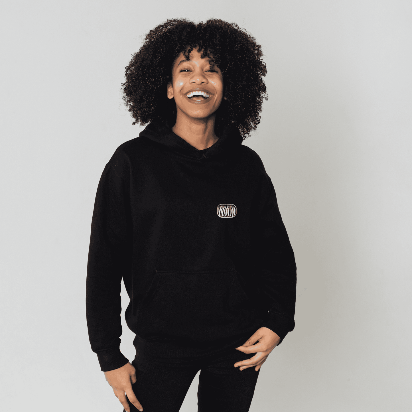 Gildan 18500 hoodie featuring small sardine can, opened, filled with sardines.
