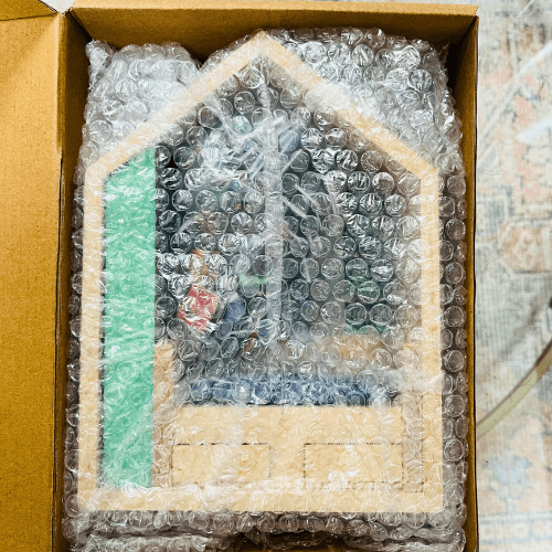 Anxiety Book Room miniature bookshelf boxed with bubble wrap for protection.