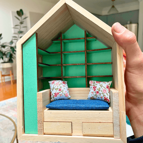 Miniature Anxiety Book Room with colorful shelves, cozy seating, and decorative pillows, ideal for sensory activities.