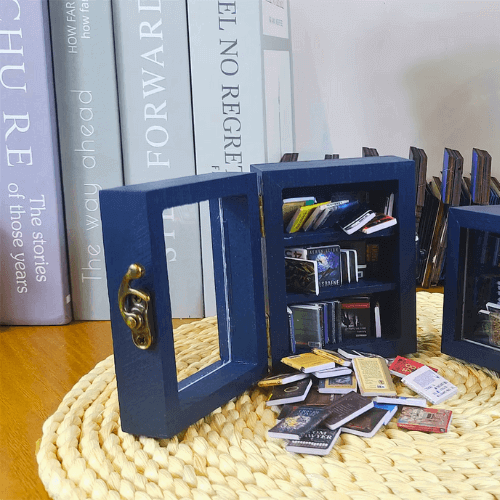 Pocket Anxiety Bookshelf mini blue bookcase with a clear display cover which opens to display mini books.