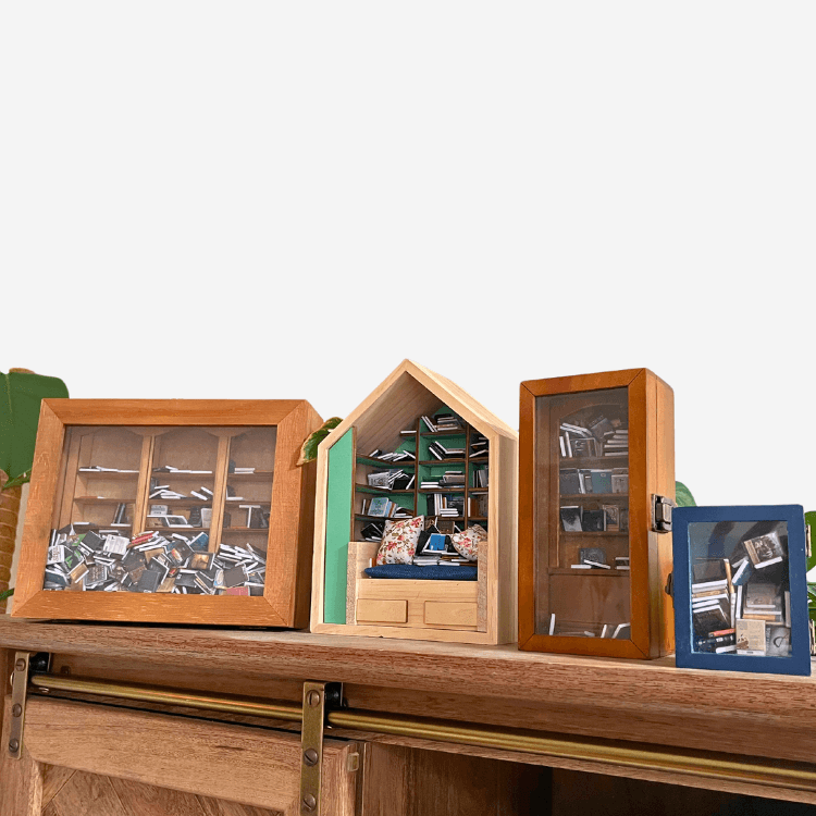 Four Piece Anxiety Bookshelf Collection Bundle showcasing colorful miniature bookshelves filled with tiny books.
