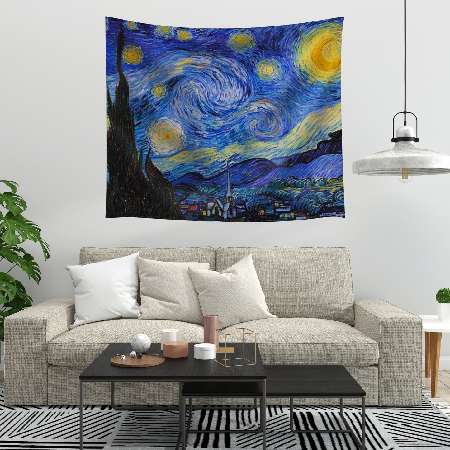 van gogh's 'The Starry Night' on a large fabric tapestry displayed on a wall.