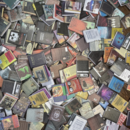 Books for the Anxiety Bookshelf sit on a table. Detailed readable covers are featured.