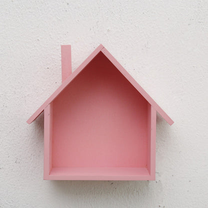 A handmade house shaped floating bookshelf available in green, white, gold, red, pink, and blue.