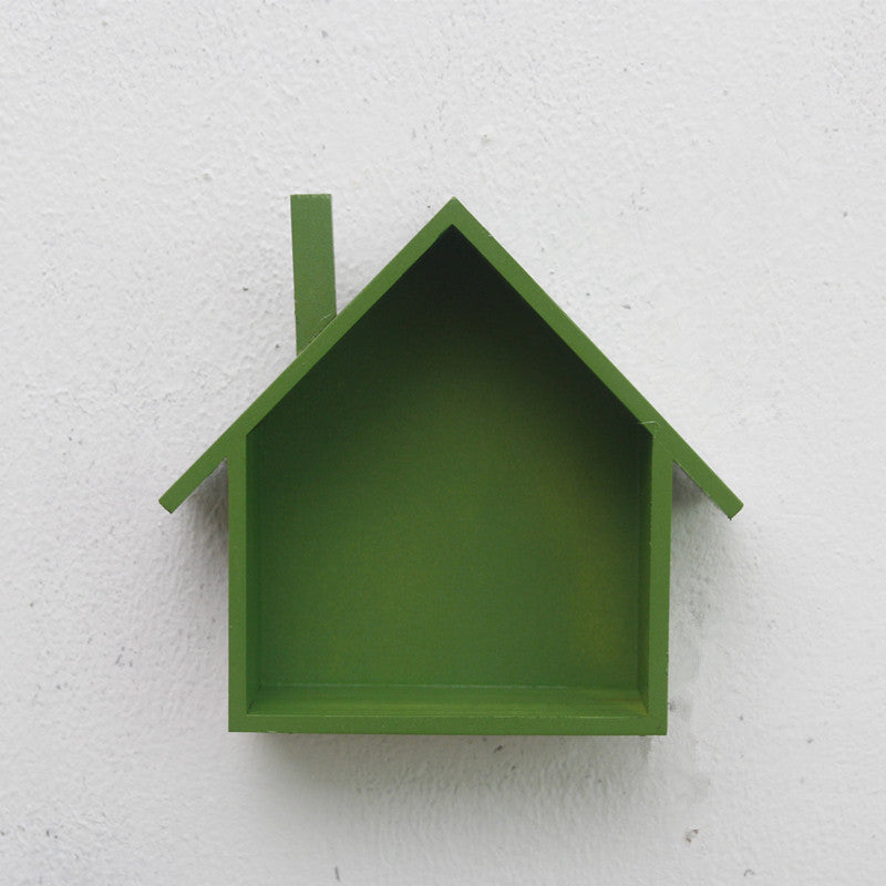 A handmade house shaped floating bookshelf available in green, white, gold, red, pink, and blue.