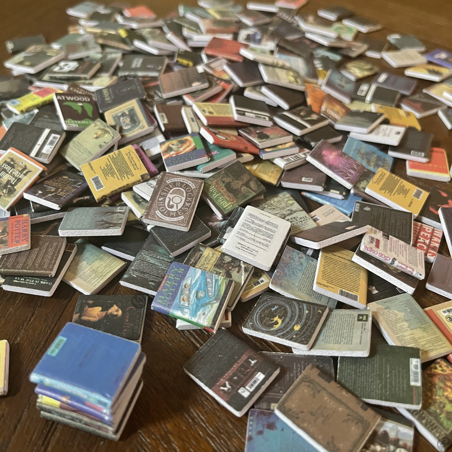 Anxiety Bookshelf books sit in a pile on a table, showing the covered spine.