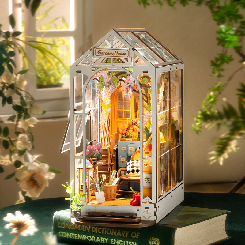 Greenhouse garden book nook. An illuminated DIY book nook that replicates a miniature garden.