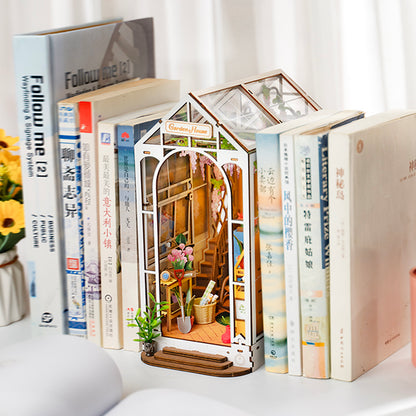 Greenhouse garden book nook. An illuminated DIY book nook that replicates a miniature garden.