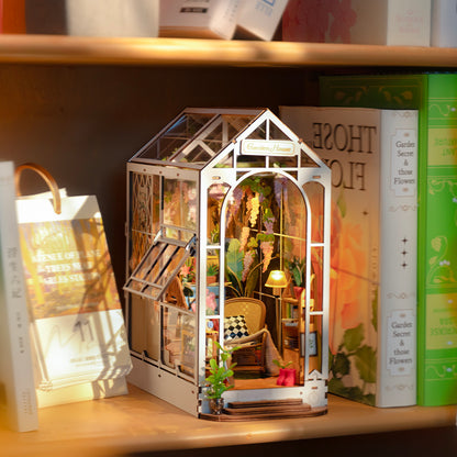 Greenhouse garden book nook. An illuminated DIY book nook that replicates a miniature garden.