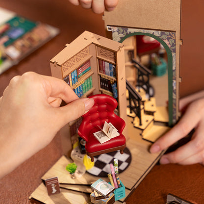 DIY Illuminated Bookstore Book Nook. A mini book store that fits on your bookshelf alongside book.