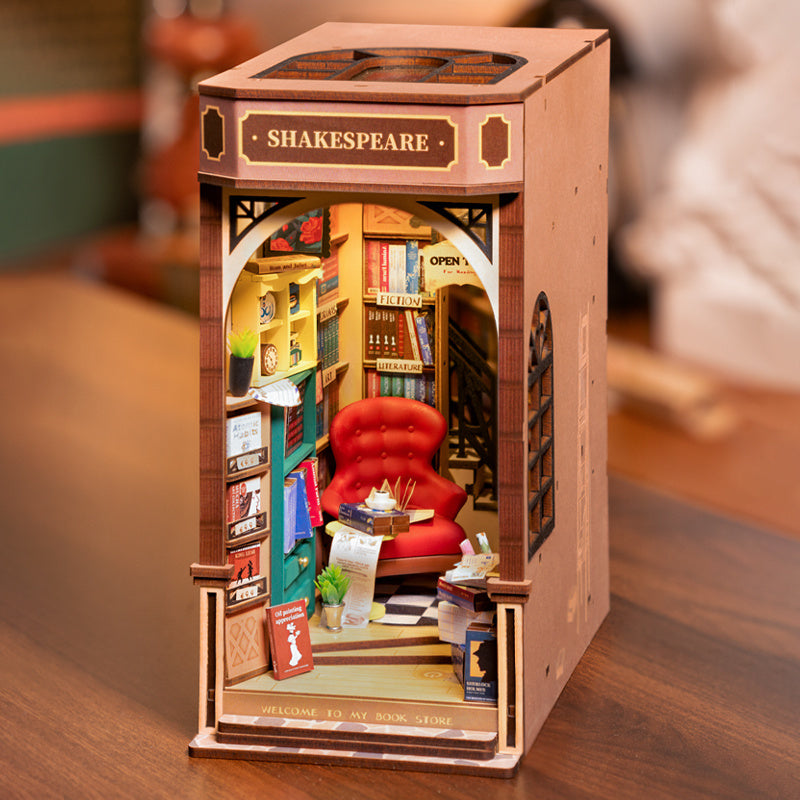 DIY Illuminated Bookstore Book Nook. A mini book store that fits on your bookshelf alongside book.