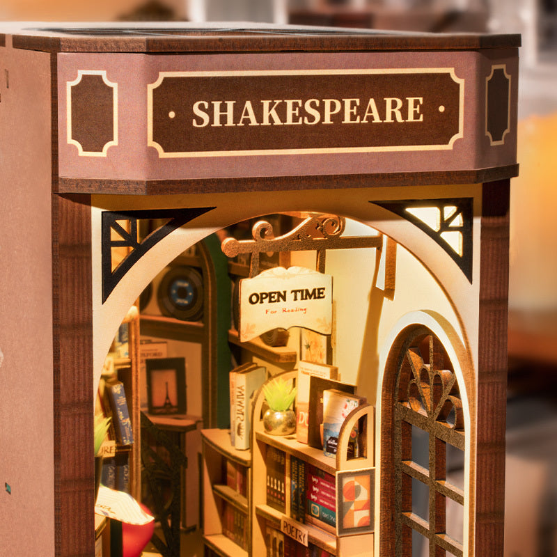 DIY Illuminated Bookstore Book Nook. A mini book store that fits on your bookshelf alongside book.