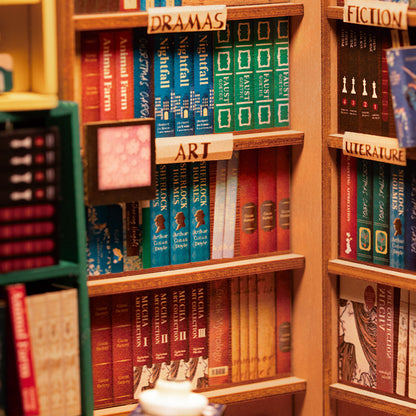 DIY Illuminated Bookstore Book Nook. A mini book store that fits on your bookshelf alongside book.