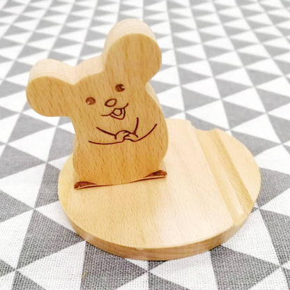 Wood animal-shaped phone stand featuring a cute mouse design, perfect for displaying phones in a playful manner.