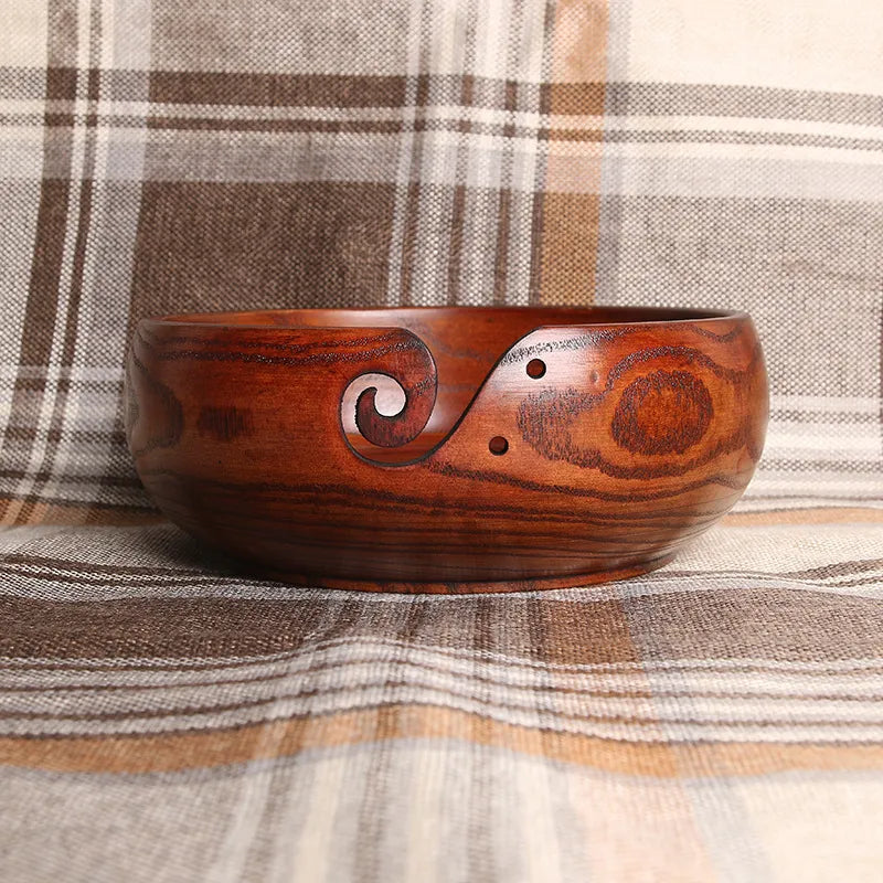 Hand carved crochet yarn bowls in a dark golden wood stain.