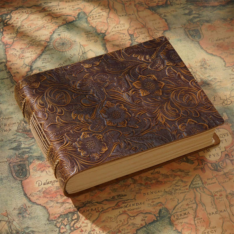 Landscape oriented floral and paisley pattern leather sketchbook.