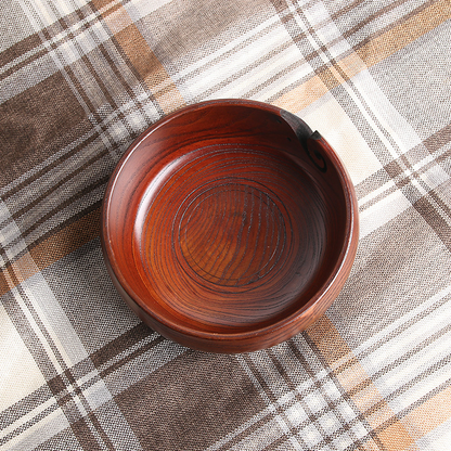 Hand carved crochet yarn bowls in a dark golden wood stain.