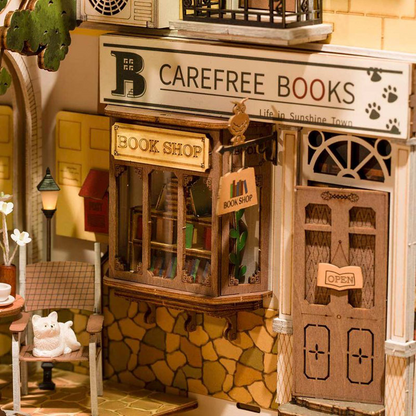 A close up of a miniature coffee shop inside of the book nook.