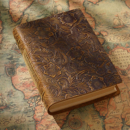  A floral and paisley pattern leather sketchbook.