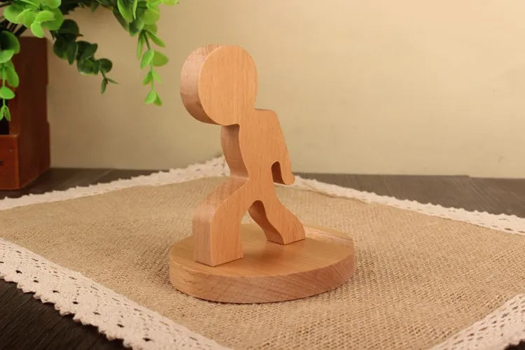 Wood animal shaped phone stand designed as a playful stick figure, perfect for holding phones upright.