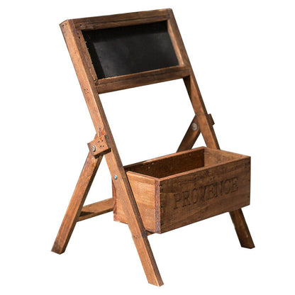 A wooden folding shelf with attached planter and chalkboard to label the plants inside.