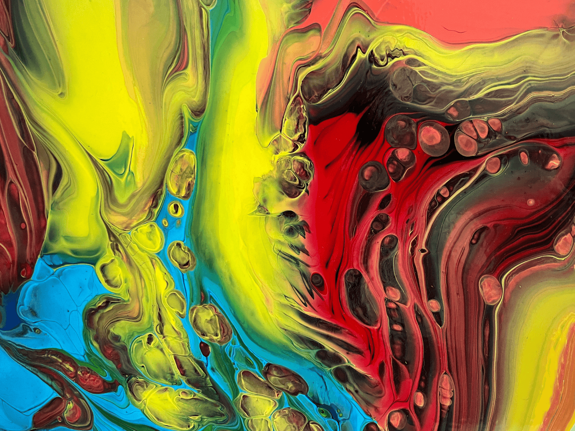 red, yellow and blue fluid art painting on canvas representing fire and ice