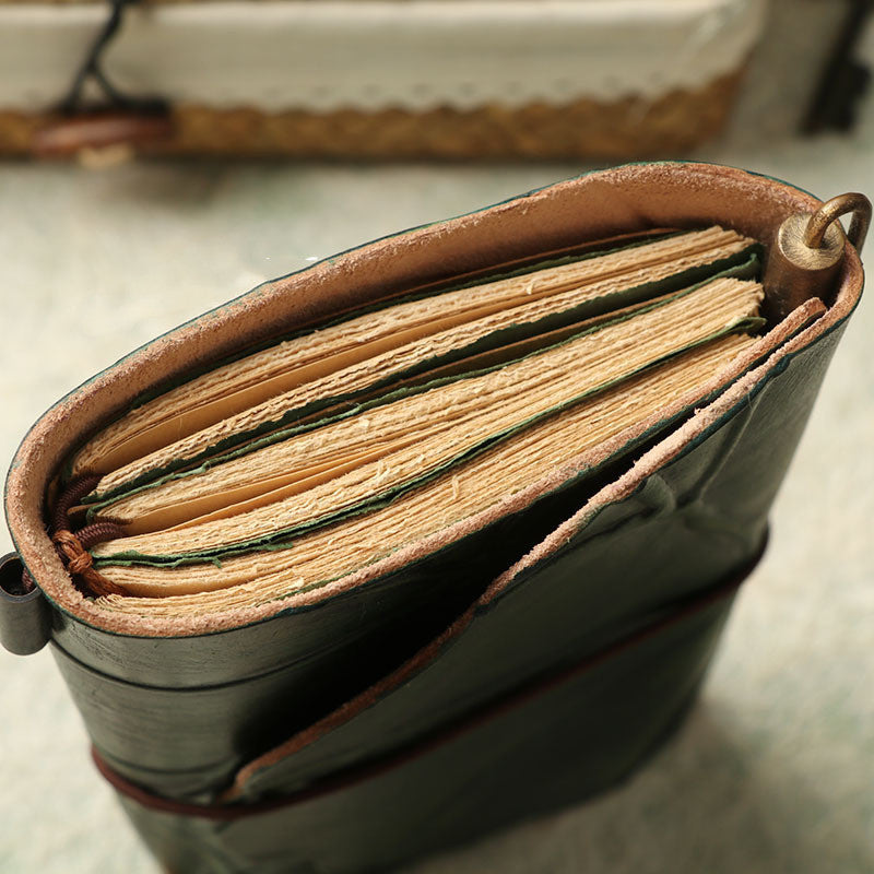 Leather leaf wrapped notebook. A green, natural lembas bread wrap leaf around a classic blank note paper.