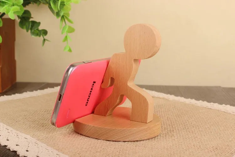 Wooden animal shaped phone stand in a playful stick figure design, perfect for holding phones upright.