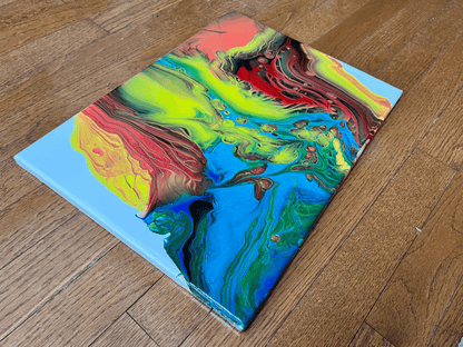 red, yellow and blue fluid art painting on canvas representing fire and ice