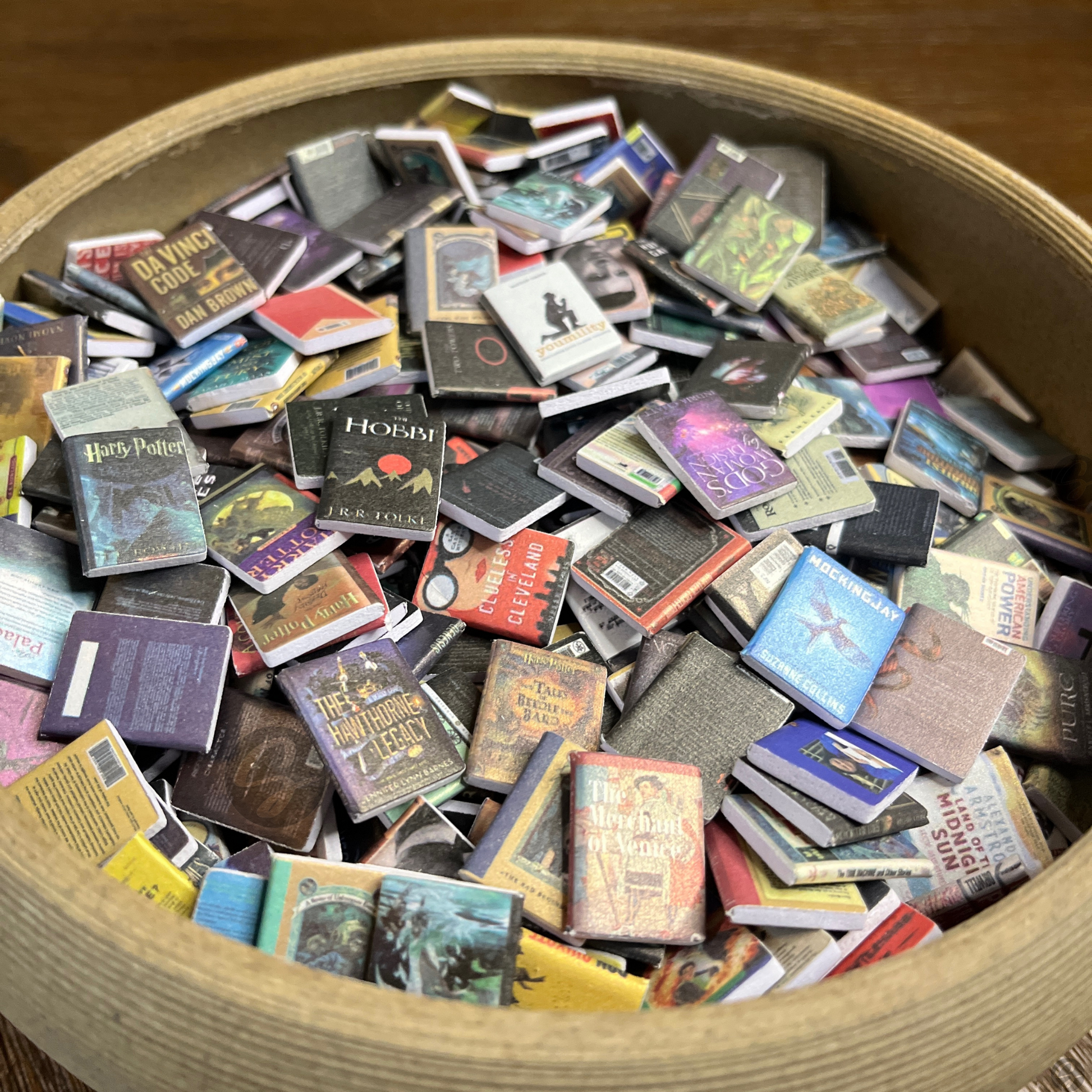 Anxiety Bookshelf books sit in a bowl. The best mini bookshelf books for the bookcase fidget toy.