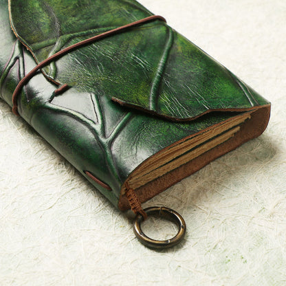 Leather leaf wrapped notebook. A green, natural lembas bread wrap leaf around a classic blank note paper.