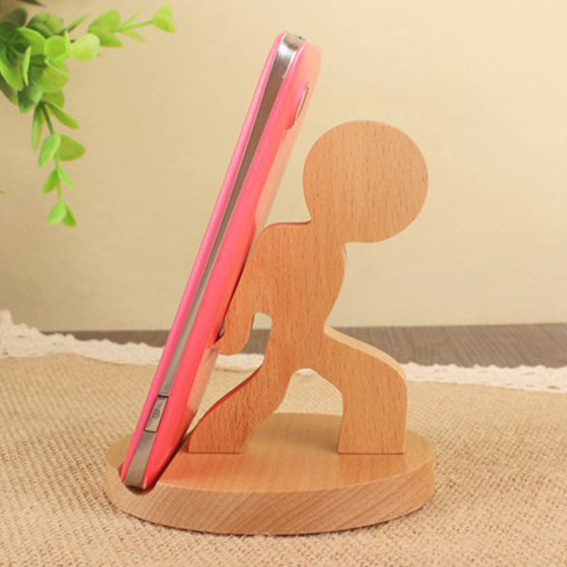 Wood animal shaped phone stand featuring a playful stick figure design, perfect for holding your phone upright.