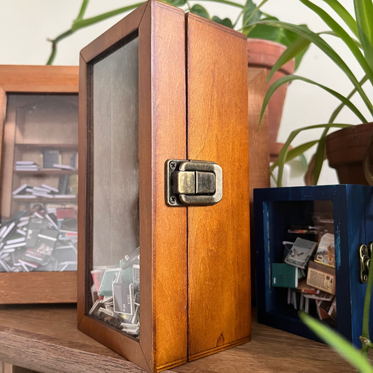 Anxiety Bookcase mini bookshelf fidget toy. The metal latch is featured in this image.