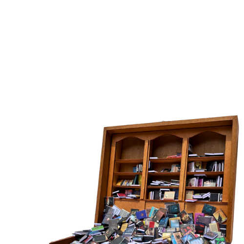 Anxiety Bookshelf over white background, open displaying miniature books.