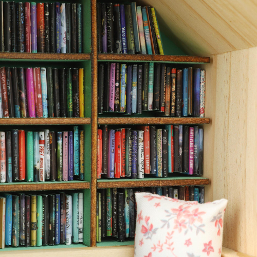 Anxiety Book Room mini book nook filled with the best miniature books. A mini room with a bed, drawers and bookcases to help relieve stress.