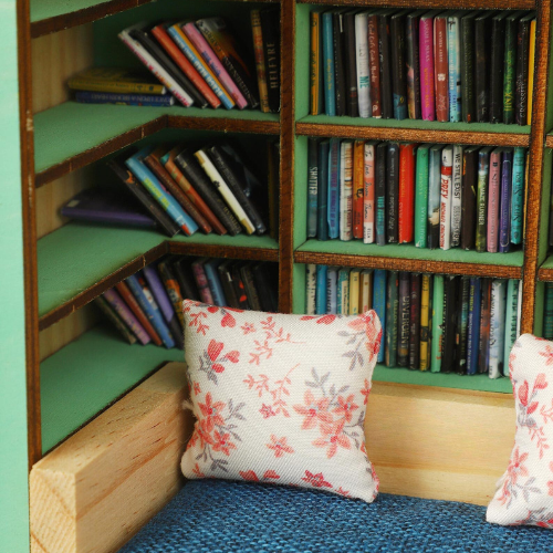 Anxiety Book Room mini book nook filled with the best miniature books. A mini room with a bed, drawers and bookcases to help relieve stress.