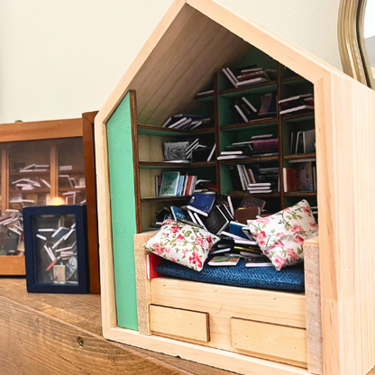 Anxiety Book Room mini book nook filled with the best miniature books. A mini room with a bed, drawers and bookcases to help relieve stress.