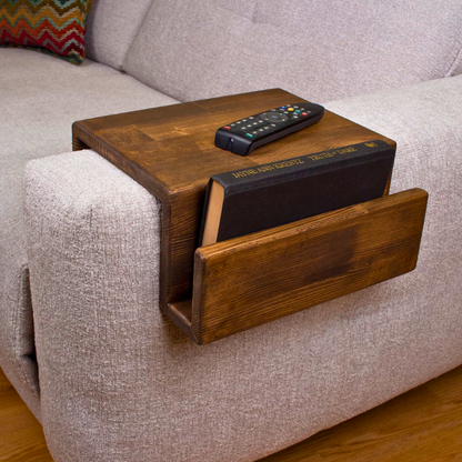 A dark solid wood handmade stained couch caddy, finished with gloss.  A rustic and truly handmade wooden armrest available in thin and wide options. Multiple sizes and stains are available, the standard size is shown.