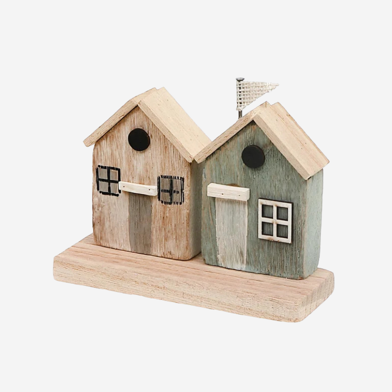 Handmade coastal themed wood houses. A two-house figurine set sits on a wood slab.