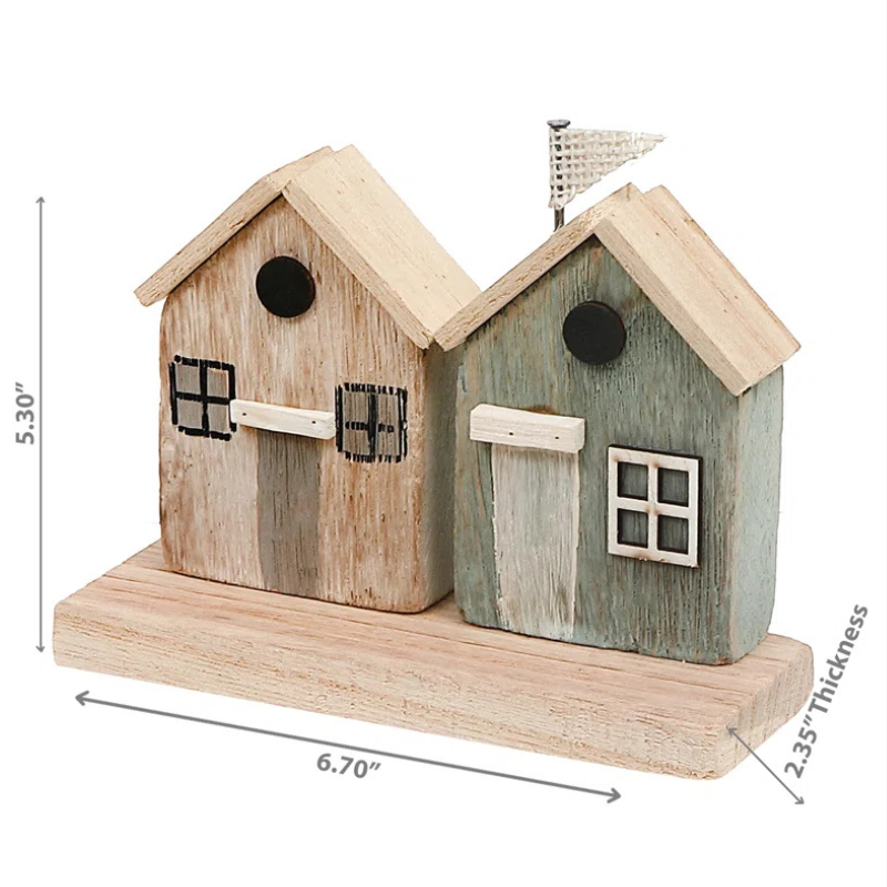 Handmade coastal themed wood houses. A two-house figurine set sits on a wood slab.