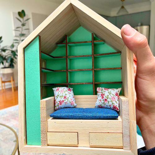 Anxiety Book room mini bookcase in a box is shown in this close up image without its mini books.