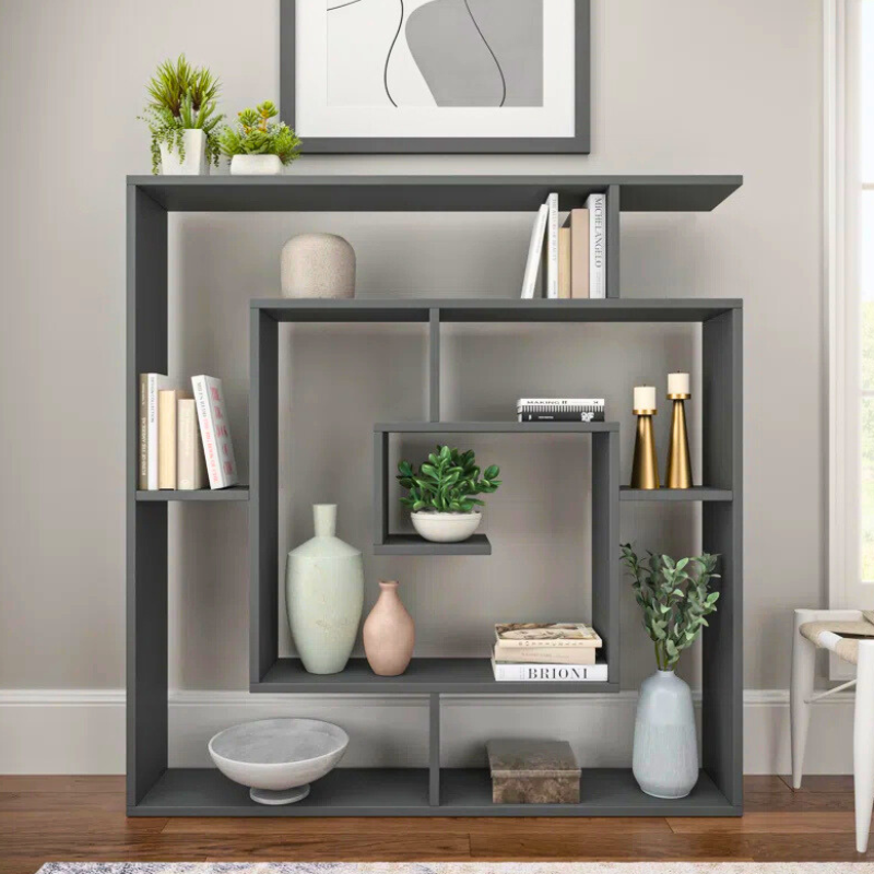 A spiralling square bookshelf is displayed. The geometric Fibonacci sequence shape of this unique bookshelf creates an artistic black bookcase. 