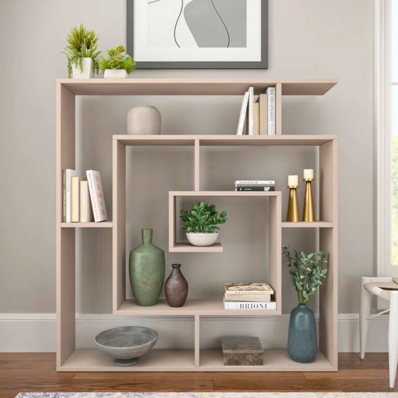 A spiralling square bookshelf is displayed. The geometric Fibonacci sequence shape of this unique bookshelf creates an artistic white bookcase. 