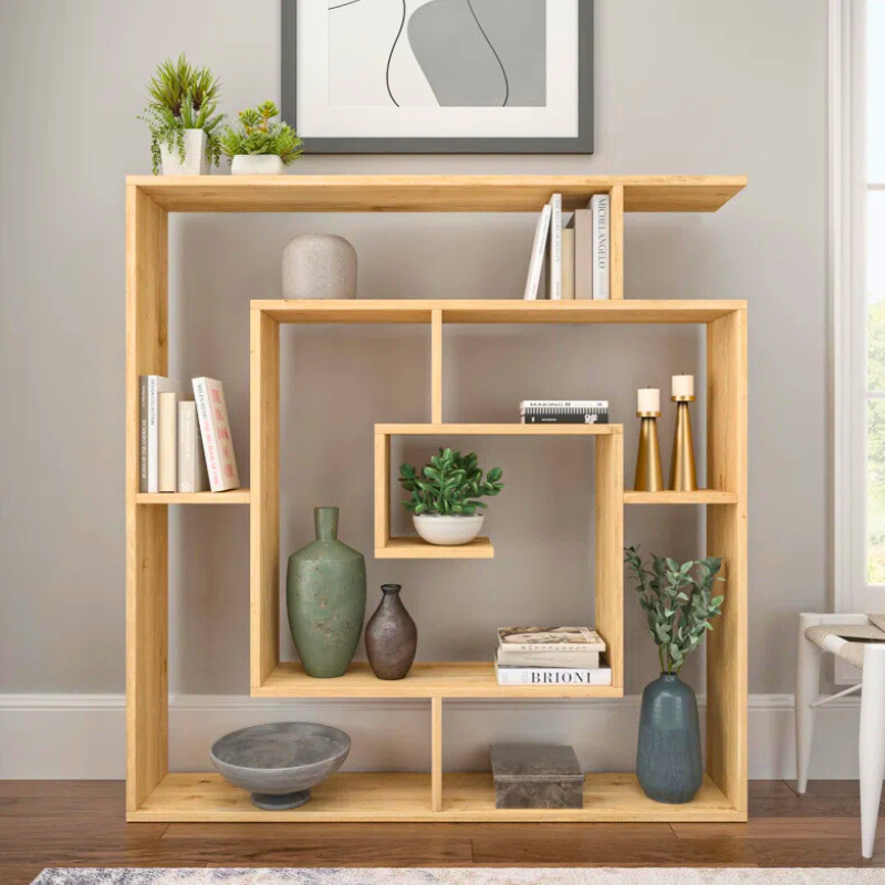 A spiraling square bookshelf is displayed. The geometric fibonacci sequence shape of this unique bookshelf creates an artistic bookcase with natural wood finish.