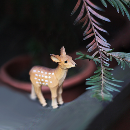 Hand-carved wooden deer ornament with natural textures, perfect gift for deer lovers and animal enthusiasts.