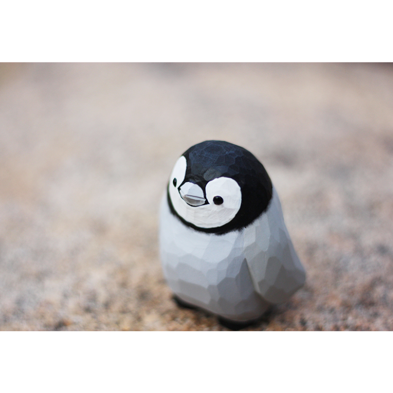 Hand-carved penguin ornaments, unique wooden figurines, perfect gift for penguin lovers.