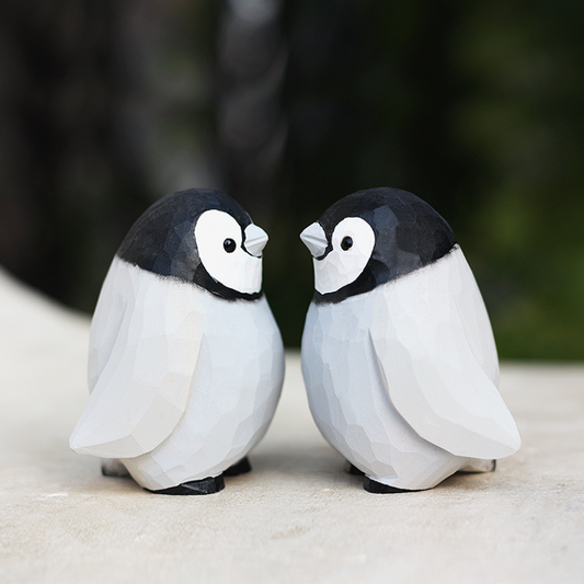 Hand-carved penguin ornaments, unique wooden figurines, perfect gift for penguin lovers.