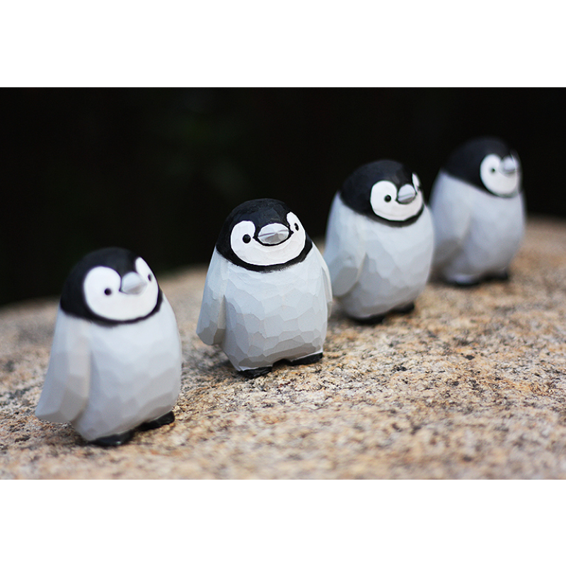 Hand-carved penguin ornaments, unique wooden figurines, perfect gift for penguin lovers.