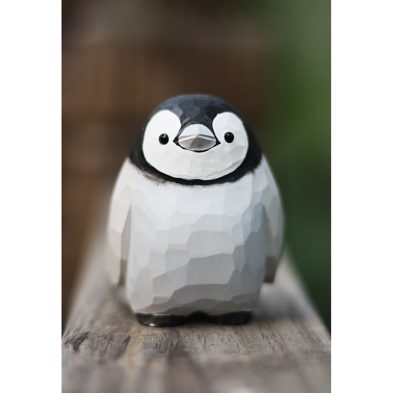 Hand-carved penguin ornaments, unique wooden figurines, perfect gift for penguin lovers.