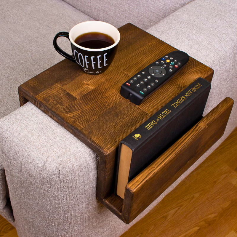 A solid wood handmade stained couch caddy, finished with gloss.  A rustic and truly handmade wooden armrest available in thin and wide options. Multiple sizes and stains are available, the standard size is shown.